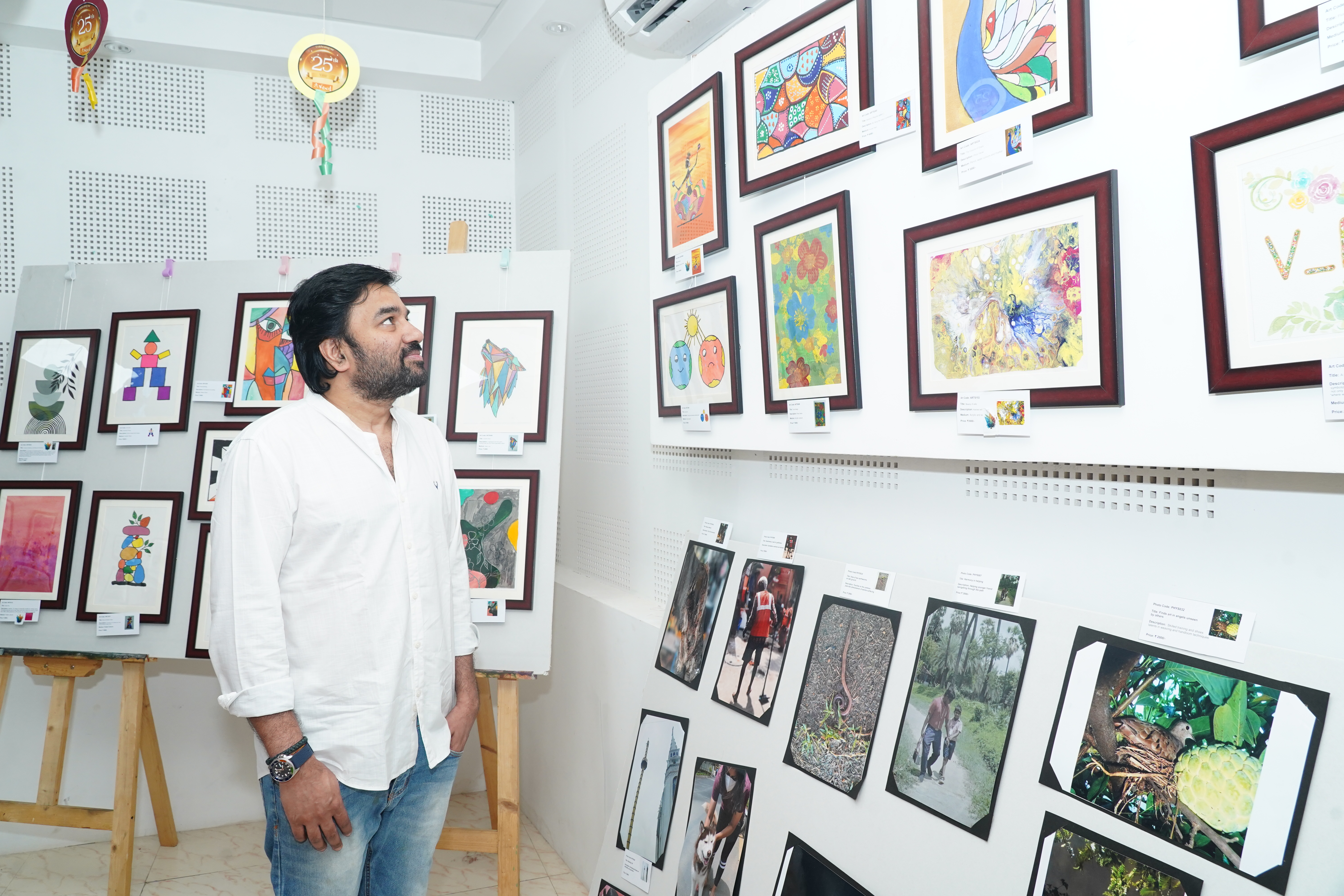 Framed artworks displayed at the Tattva inclusive art exhibition
